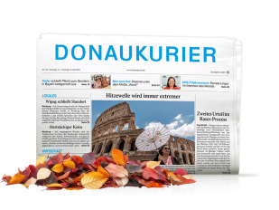 Printausgabe des Donaukurier mit bunten Laubblättern davor
